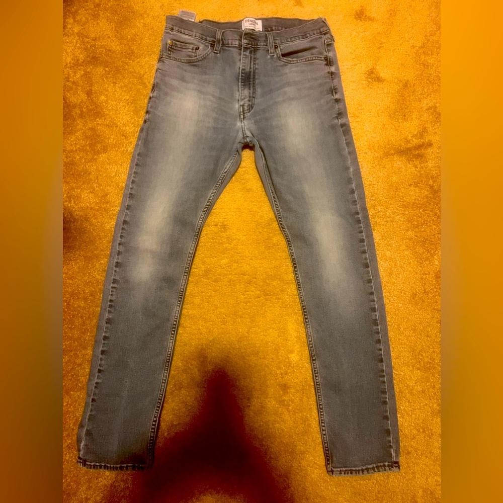 Vintage style tired blue jeans